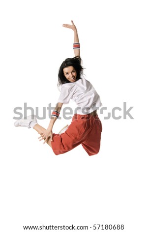 Cheerful breakdancer leaping high on white background
