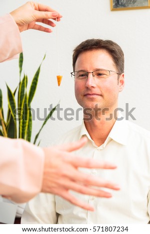 Man Being Hypnotized By Therapist