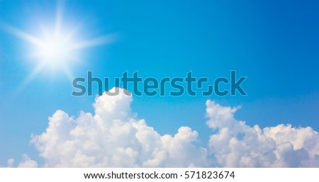 clouds and sun in the blue sky background.