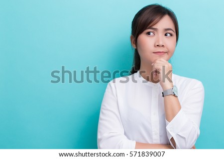 Asian woman thinking on isolated background