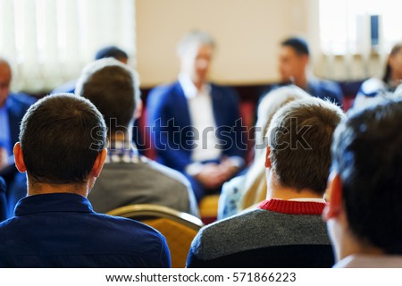 Business style dressed CEO lead the team building meeting in small class room. Education, Business Entrepreneurship concept. Business Conference and Presentation. Selective focus at rear view student. Royalty-Free Stock Photo #571866223