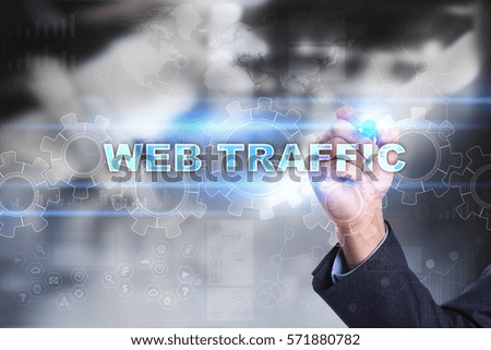 Businessman drawing on virtual screen. web traffic concept.
