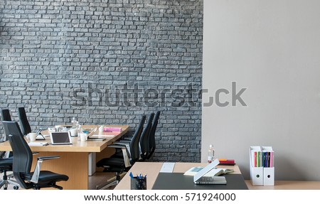 office interior behind brick wall 