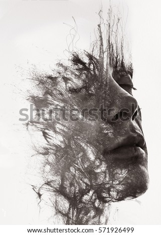 Paintography. An attractive man's face dissolving into pen lines