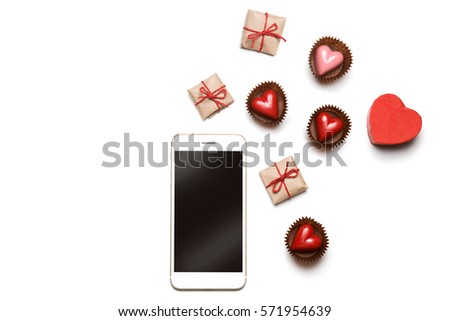 Styled Valentine's Day flatlay top view isolated on white. Sweet hearts, gifts in craft paper, smartphone mockup. Minimal web image. Love concept