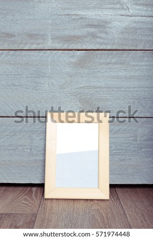  photo frames on the wooden wall