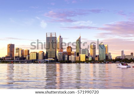 Perth, Western Australia.  City skyline over Swan River at sunset. Royalty-Free Stock Photo #571990720