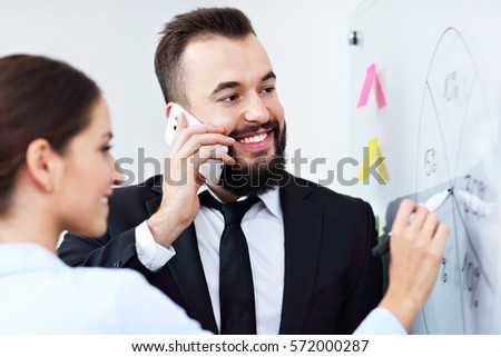Picture of businesspeople working together in office