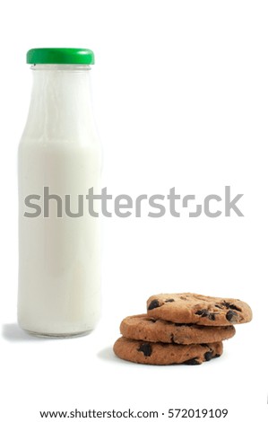 Milk in traditional bottle with chocolate chip cookies isolated on a white background