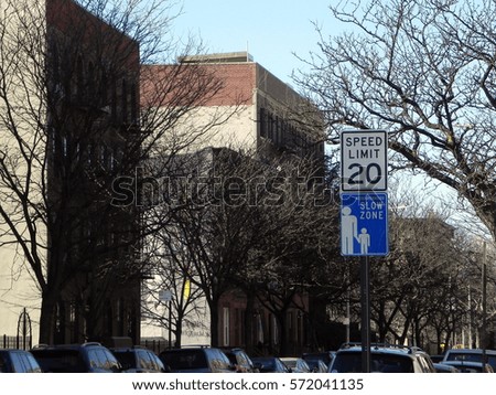slow zone urban sign