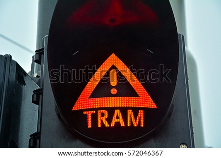 Red traffic light - warning sign about an approaching tramway (streetcar) 