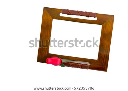 Wooden picture frame with rose flower isolated on white background. Close up  of photo frame with flower.