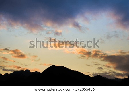 Beautiful sunset sky with a big moutain.