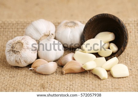 Organic garlic on wooden background.