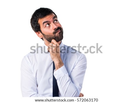 Businessman in his office thinking Royalty-Free Stock Photo #572063170