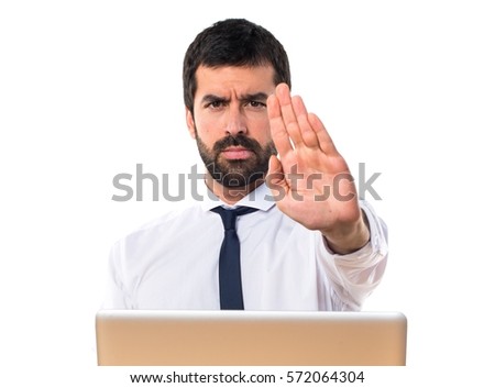 Businessman in his office making stop sign