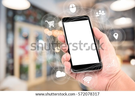 woman hand hold and touch screen smart phone with tech icon flow, tablet,cellphone over blurred background;Transactions by smartphone concept