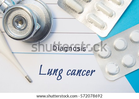 Diagnosis Lung Cancer. Doctor's stethoscope, electronic thermometer and two blisters of pills lying near pad with inscription of diagnosis Lung Cancer. Concept of report in internal medicine