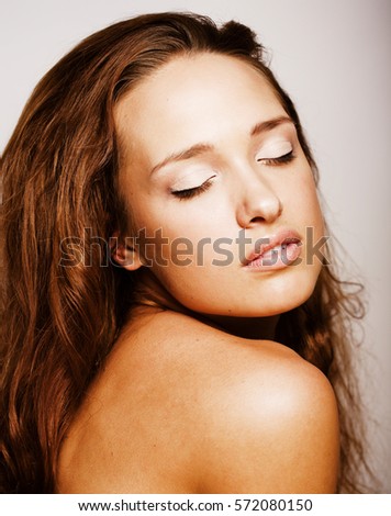 young pretty brunette woman taking care of her skin, soft spa people concept