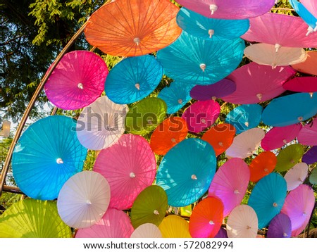 Parasol colors arranged in a tunnel used for ornamental party.
