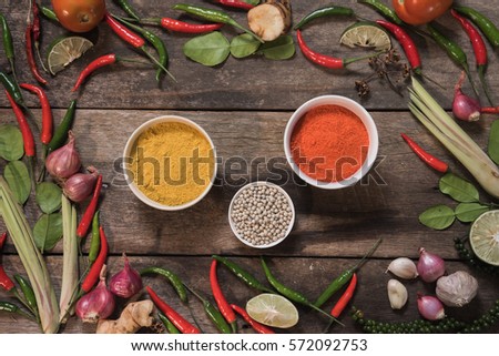 spices with ingredients on wood background. asian food, healthy or cooking concept.