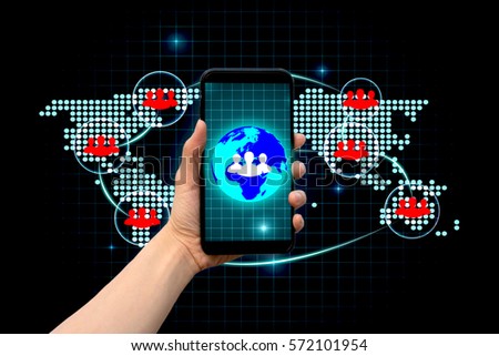 Social network and communications concept with close up of people hand using phone and world map connection diagram.