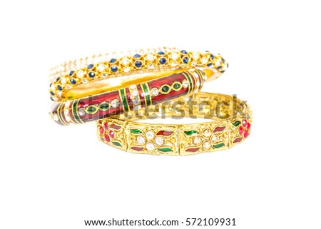 Gold bracelets with gem and diamonds isolate on white background. 