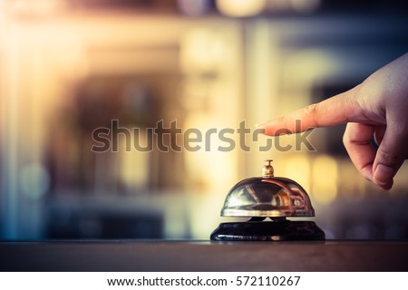 Bell call vintage service with hand Royalty-Free Stock Photo #572110267