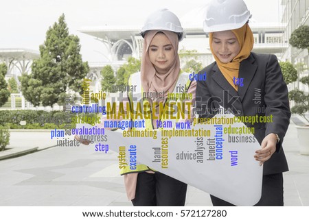 Project management word cloud and background of 2 young female engineers.
