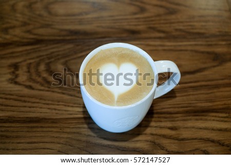 latte art draw heart in coffee cup.