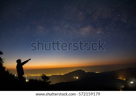 Silhouette of Tree with cloud and Milky Way. Long exposure photograph.