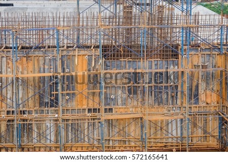 View of a metal scaffolding by work on dam construction site, Thailand.