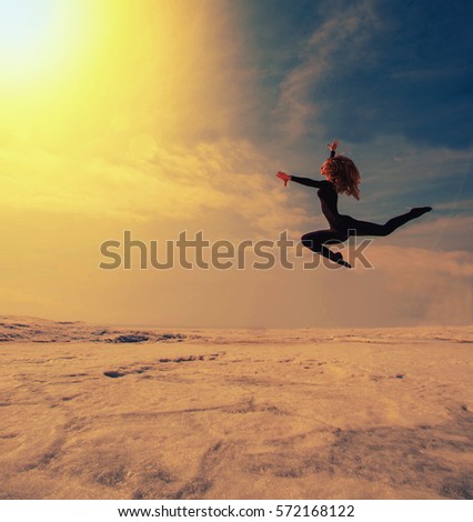 gymnast high and beautifully jumping in the snow
