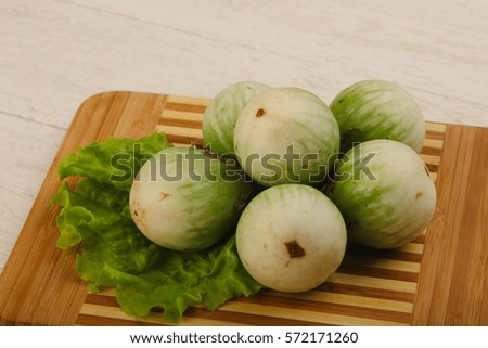 Asian round eggplant heap on the wood background
