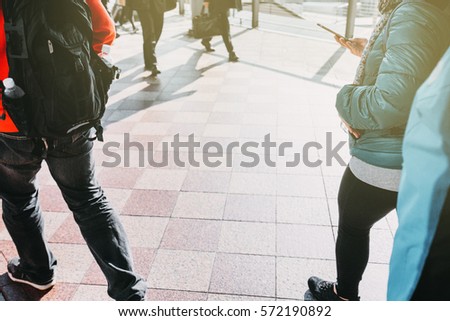 people walking in the street, (blur focus)
