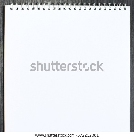 Blank open sketchbook on wooden table