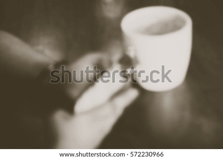 Blurred abstract background of use phone in coffee shop
