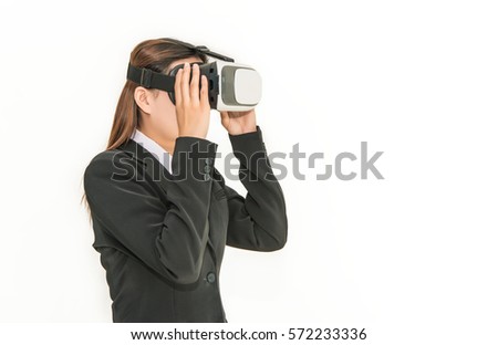 Asian woman wearing virtual reality with business suit at sunset background, VR technology concept.