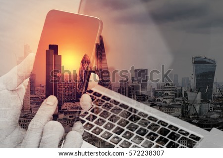 double exposure of hand using smart phone,laptop, online banking payment communication network technology 4.0,internet wireless application development sync app,London architecture city