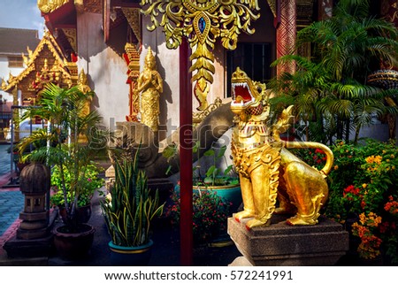 Statue of golden dragon in Buddhist temple of Chiang Rai, Thailand