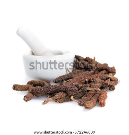Long black pepper (Also called as Pipli in Indian, capsicum frutescens, Balinese pepper, Jaborandi pepper, Bengal pepper, Dipli in Thai, Piper longum) with mortar isolated on white background