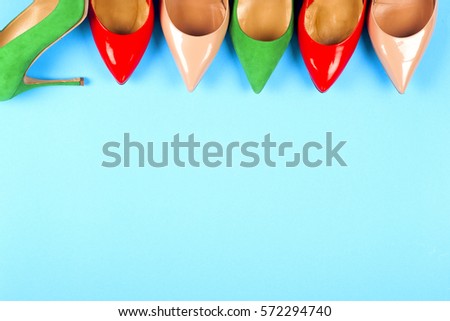 Picture of different leather shoes on light blue background. Copy space for text.