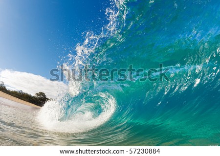 Beautiful Blue Ocean Wave breaking on Sunny Beach
