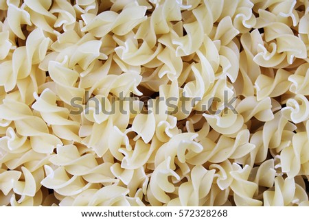 
Fusili dry pasta background concept. Pasta texture for background uses. Swirled pasta pattern. Food photography in studio.