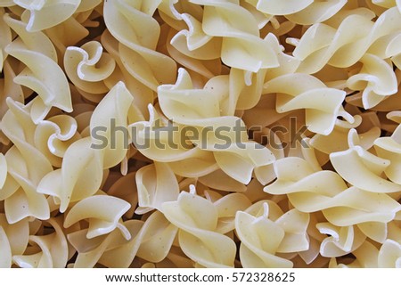 
Fusili dry pasta background concept. Pasta texture for background uses. Swirled pasta pattern. Food photography in studio.