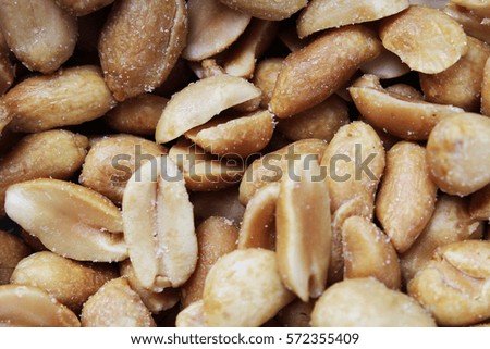 Peeled peanuts background food photography in studio. Close up macro peanuts photo. Beautiful salted roasted peanuts pattern concept.