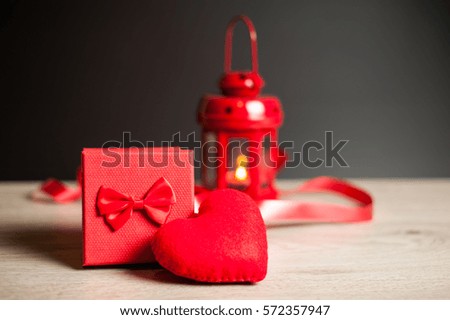 Composition consist of roses, gift boxes and heart near the white sheet with the inscription on Valentine's Day or any other holiday