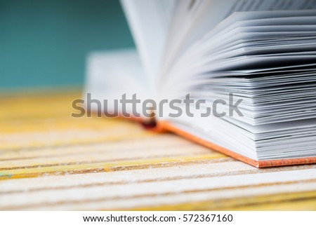 Open book on wooden table. Back to school. Copy space