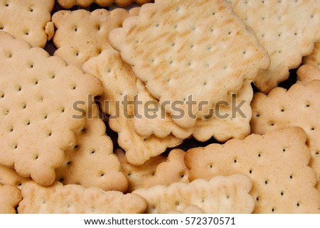 Biscuit sweet cookie craker background. Domestic stacked butter biscuit pattern concept. Biscuits texture close up macro. Food photo studio photography.
