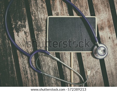 wooden signage and stethoscope lay on table ideal for medical and healthy life concept
